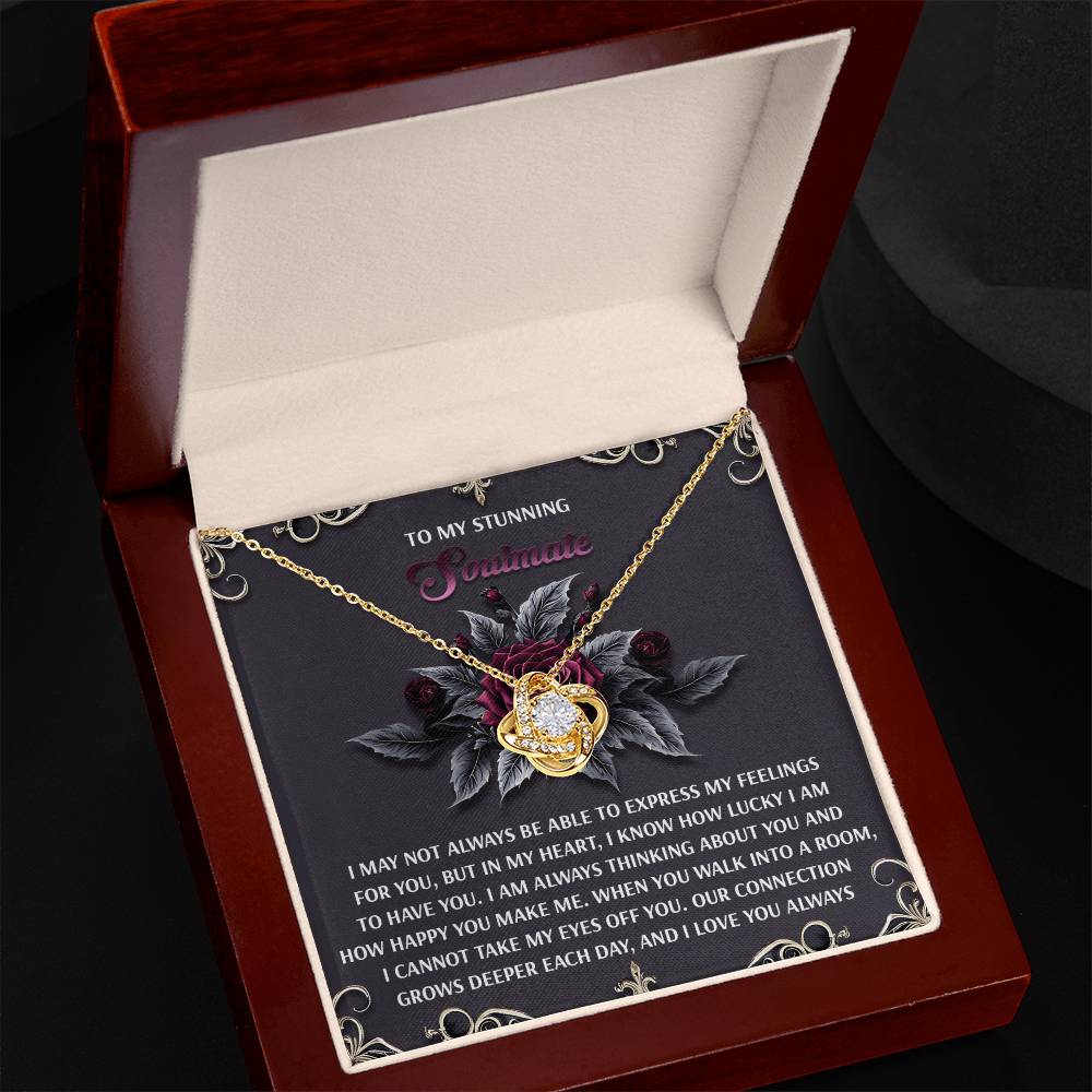 The Soulmate-Eyes Off You - Love Knot Necklace features a heart-shaped pendant with a sparkling cubic zirconia in a white gold finish, elegantly presented in a jewelry box. Inside is a card inscribed "To my stunning soulmate" with a romantic message, making it the ideal token of love.