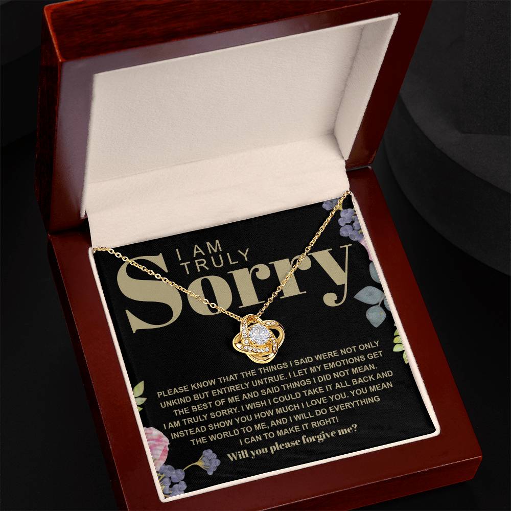 The Sorry-Best Of Me - Love Knot Necklace, featuring a heart-shaped cubic zirconia crystal pendant, is elegantly presented on a card with an apology message expressing deep regret and a sincere plea for forgiveness.