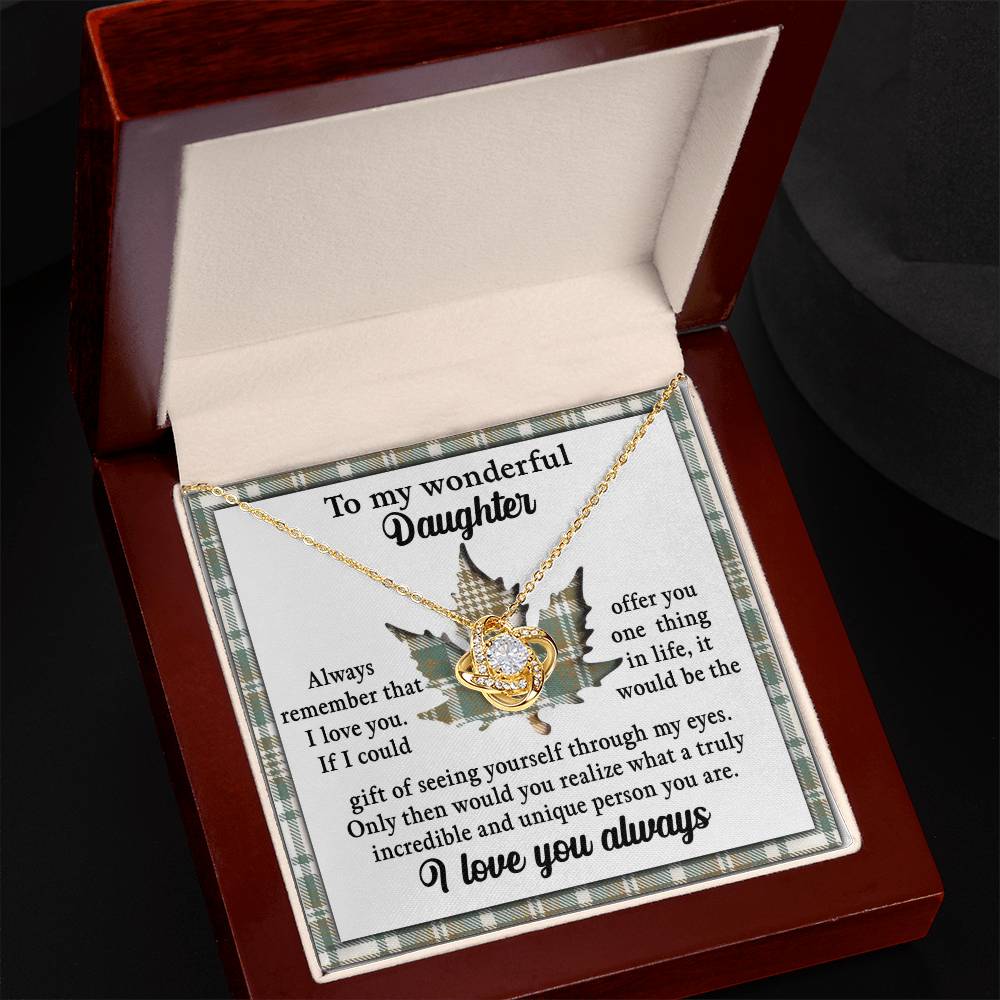 The Daughter-Through My Eyes - Love Knot Necklace, adorned with cubic zirconia crystals, is elegantly displayed in an open, red velvet-lined box with the heartfelt inscription: "To my wonderful daughter. Always remember that I love you...I love you always." This personalized gift beautifully conveys your everlasting affection.