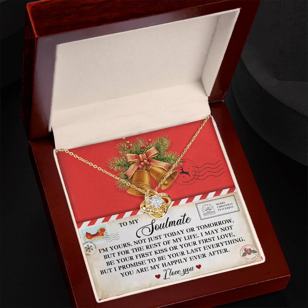 The Soulmate-Happily Ever After - Love Knot Necklace shimmers in a gift box adorned with holiday-themed decorations. Inside, a card shares a heartfelt message, enhancing the allure of this 14k white gold treasure.