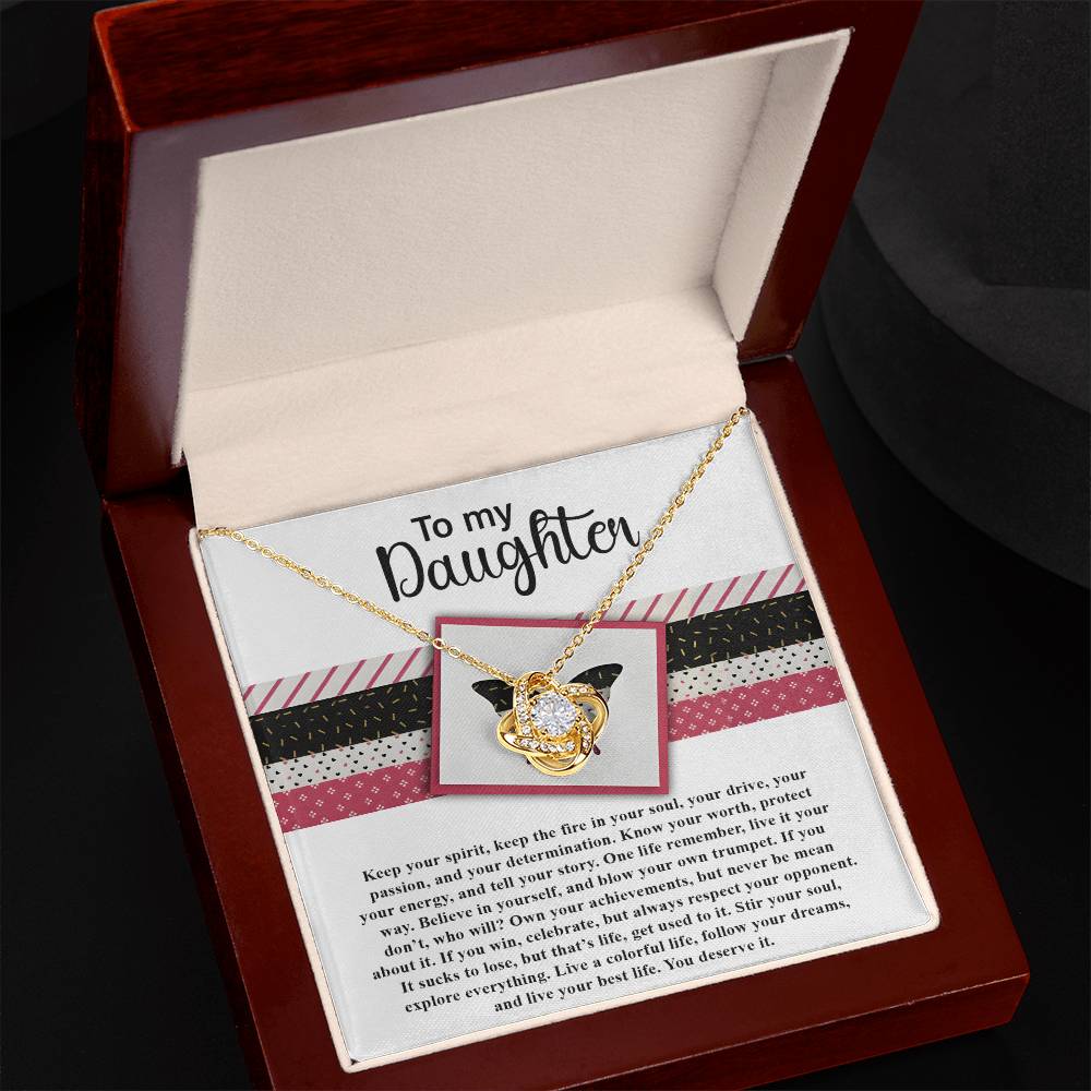 A classic gift, the Daughter-Keep The Fire - Love Knot Necklace is adorned with cubic zirconia crystals and housed in an elegant jewelry box. The inside lid reads "To my Daughter" followed by a heartfelt message.