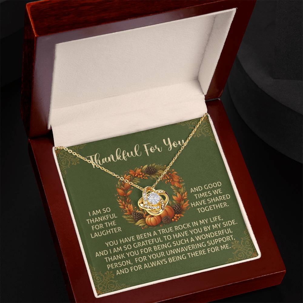 The Thanksgiving-By My Side - Love Knot Necklace features a diamond pendant elegantly presented in a gift box. Accompanied by a card with a heartfelt message of gratitude, it makes for the perfect personalized gift.