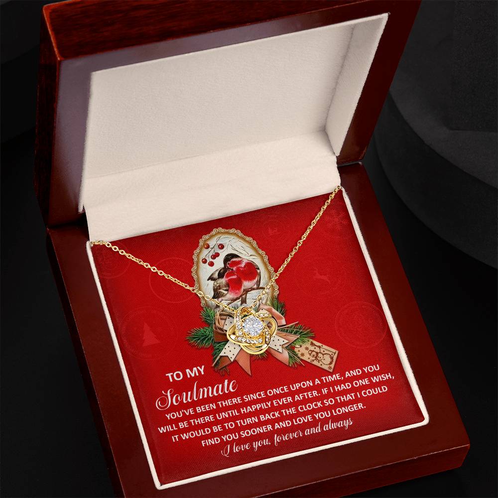 The Soulmate-Once Upon Love Knot Necklace features a heart-shaped pendant crafted from 14k white gold, beautifully presented in a gift box adorned with sparkling cubic zirconia crystals. A heartfelt message for your soulmate is elegantly printed in white text on a vibrant red background.