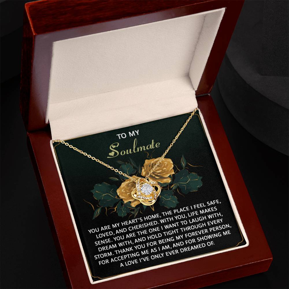 The Soulmate-Forever Person - Love Knot Necklace, made of 14k white gold with dazzling cubic zirconia crystals, rests elegantly in a red box. A heartfelt message expressing love and appreciation for a soulmate is inside the lid.