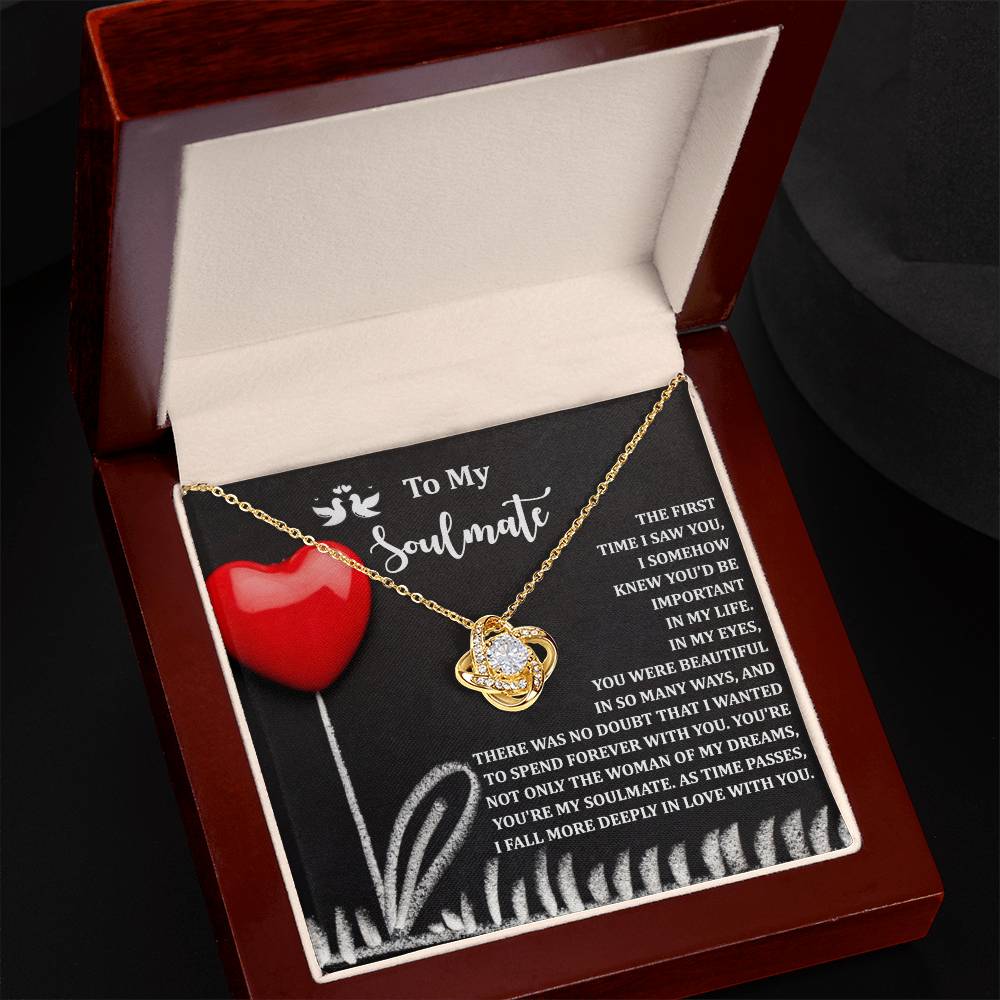 The Soulmate-Forever With You - Love Knot Necklace, adorned with cubic zirconia and a white gold finish, comes in a wooden box featuring a heartfelt message and red heart design.