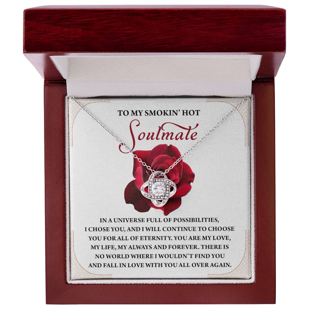 The Soulmate-Over Again - Love Knot Necklace features a heart pendant in a striking gold finish, beautifully packaged in a red box. The lid's interior displays the heartfelt message "To my smokin' hot soulmate" at the top.