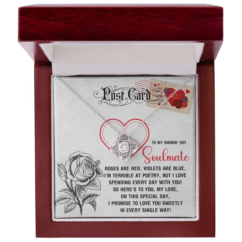 Packaged in a red box with a card that reads, "To my smokin' hot soulmate. Roses are red... I promise to love you sweetly in every single way," the Soulmate-Special Day - Love Knot Necklace dazzles with cubic zirconia crystals and includes rose and heart images.