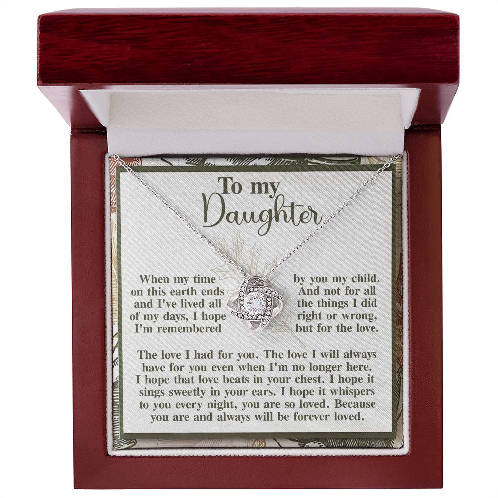 The "Daughter-In Your Ears - Love Knot Necklace" comes in an elegant open wooden box and features a heartfelt message dedicated to a daughter. It beautifully expresses love and the hope that the necklace's song will be cherished always, and is adorned with stunning cubic zirconia crystals.