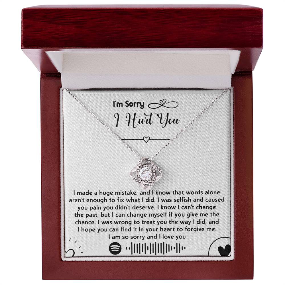The "Sorry-You Didn't Deserve - Love Knot Necklace" features an intertwined heart pendant adorned with cubic zirconia crystals and a gold finish, beautifully presented in a box with a heartfelt apology message. The message conveys deep regret, asks for forgiveness, and promises to change.