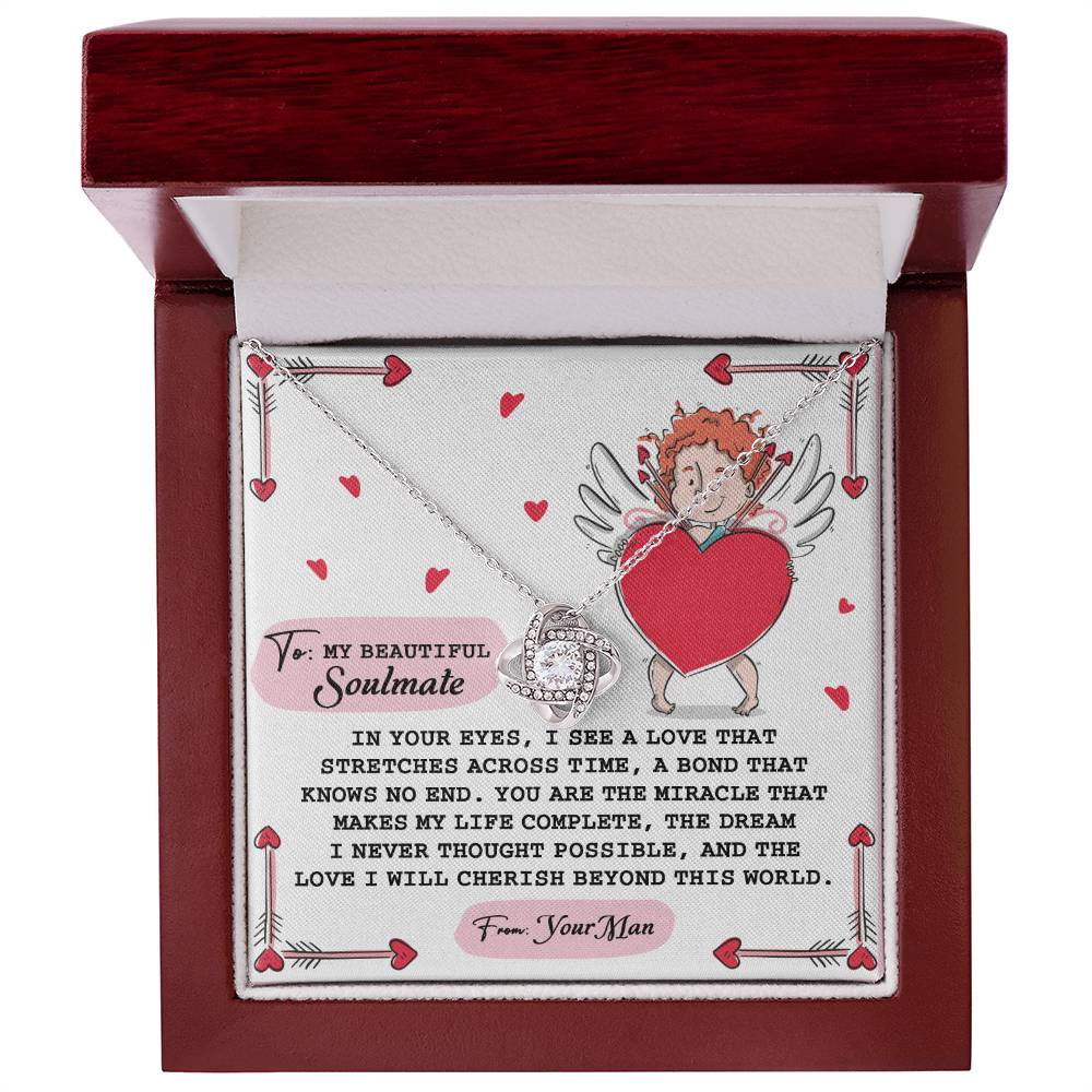 The Soulmate-No End - Love Knot Necklace, adorned with Cubic Zirconia Crystals, is presented in a box featuring an angel holding a heart. With the message "To My Beautiful Soulmate" and romantic embellishments like hearts and wings, it makes the perfect personalized gift.