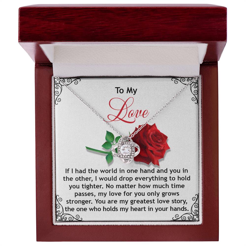 The Soulmate-In Your Hands - Love Knot Necklace, embellished with cubic zirconia crystals, comes in a red and white box with a rose design and romantic message, making it an ideal personalized gift for your loved one.