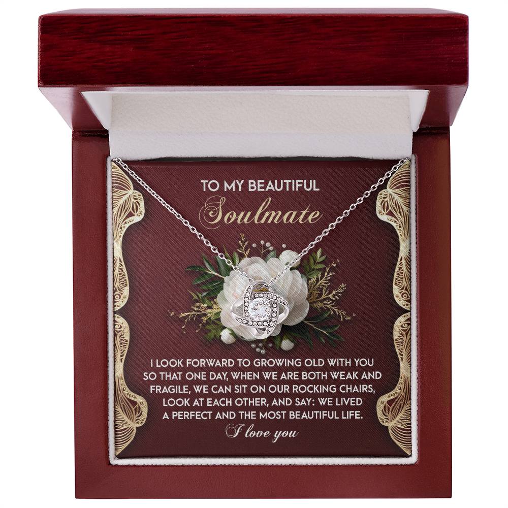 The Soulmate-Rocking Chairs - Love Knot Necklace showcases a heart pendant with sparkling cubic zirconia in a box, paired with an endearing message about love and growing old together, offering a perfect personalized gift for someone special.