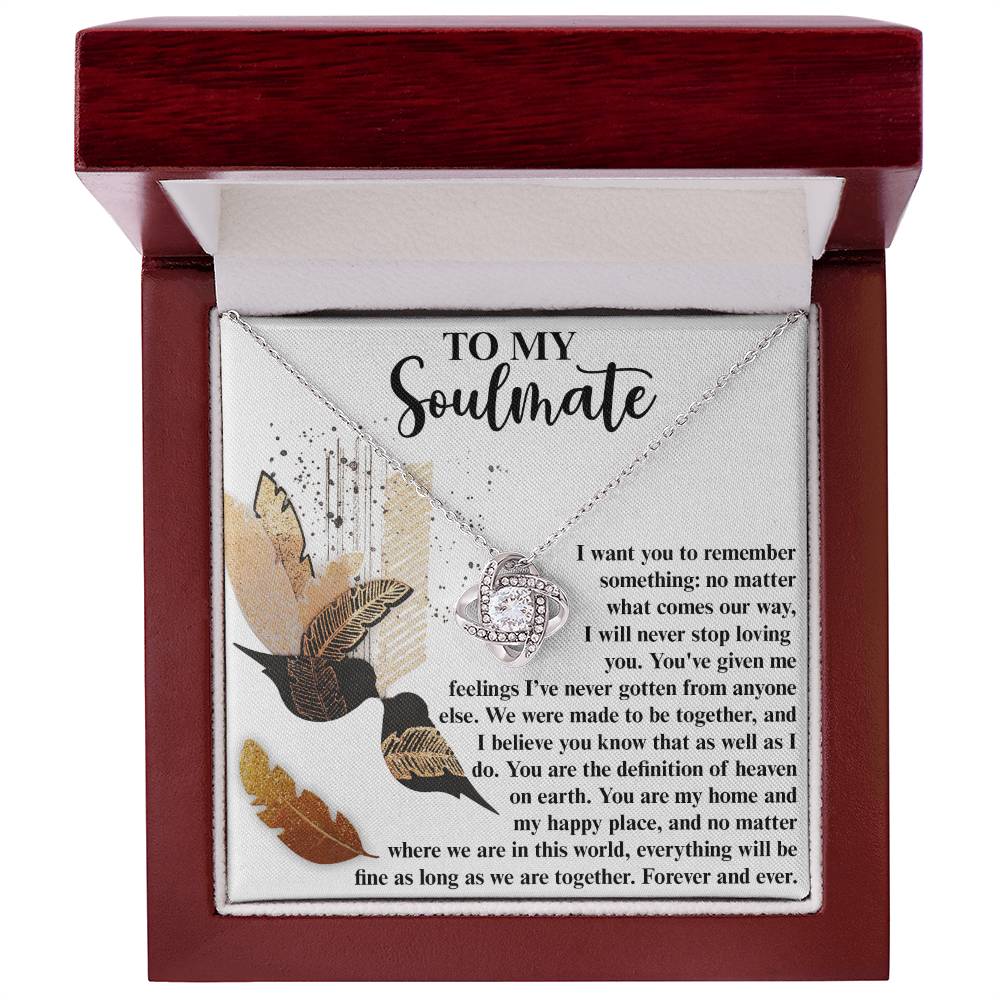 The Soulmate-Given Me Feelings - Love Knot Necklace, adorned with cubic zirconia crystals, is beautifully nestled in a wooden box and comes with a heartfelt message card addressed "To My Soulmate," expressing eternal love and devotion.