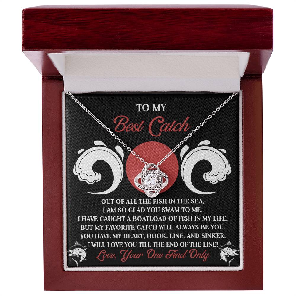 The Soulmate-Of The Line - Love Knot Necklace, in a wooden box, highlights a romantic "best catch" message. With cubic zirconia crystals and a gold finish, it elegantly intertwines love with fishing, symbolizing an everlasting bond.