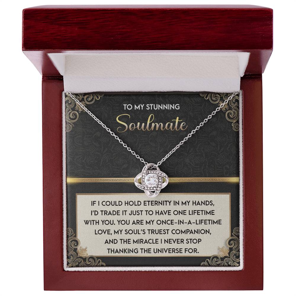 The Soulmate-Truest Companion Love Knot Necklace, featuring a ring pendant, is elegantly displayed in a jewelry box with a heartfelt message to your soulmate. Adorned with cubic zirconia crystals, it's the perfect personalized gift for expressing eternal love and gratitude.