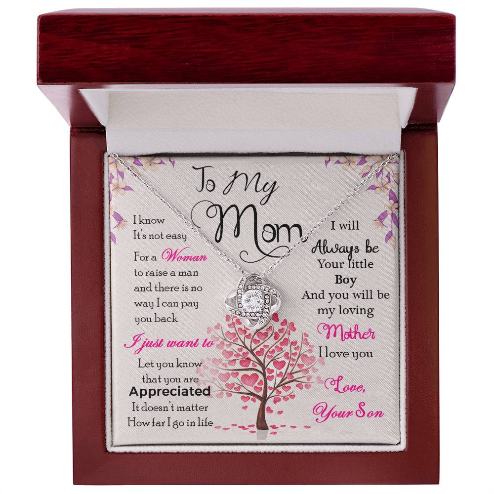 Jewelry gift box with a heartfelt message and a "To My Mom, I Know Its Not Easy" Love Knot Necklace for a mother from a son, adorned with cubic zirconia on a gold finish by ShineOn Fulfillment.