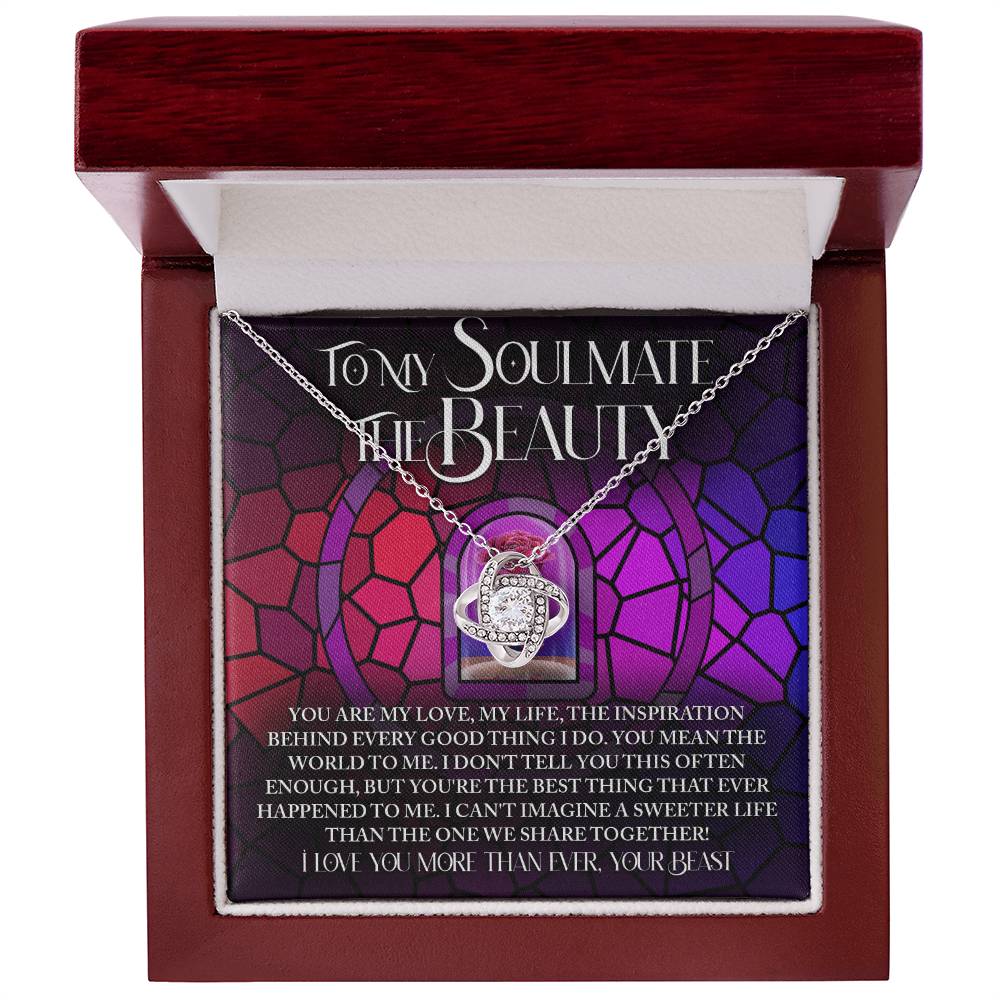 Discover the perfect personalized gift, the Soulmate-Sweeter Life Love Knot Necklace. Featuring a stunning heart pendant adorned with cubic zirconia crystals, it arrives in an elegant box with a heartfelt message for your soulmate against a vibrant multicolored background.