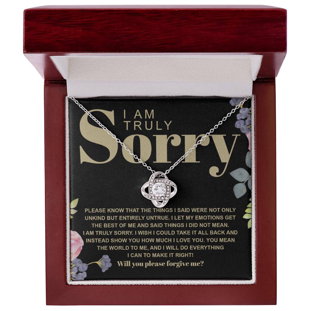 The Sorry-Best Of Me - Love Knot Necklace, featuring a heart-shaped cubic zirconia crystal pendant, is elegantly presented on a card with an apology message expressing deep regret and a sincere plea for forgiveness.