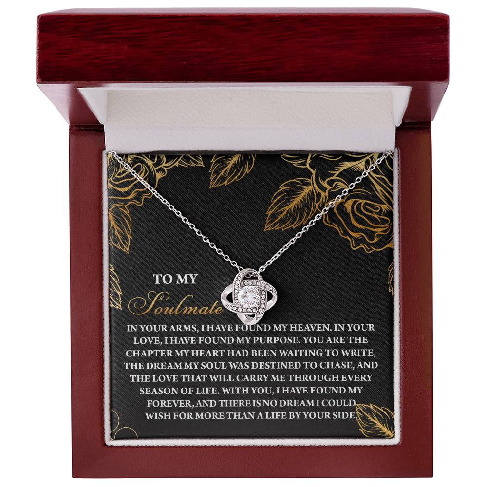 The Soulmate-By Your Side - Love Knot Necklace, featuring a planet pendant, comes in a wooden box. The lid displays a romantic message with floral designs and sparkling cubic zirconia crystals.