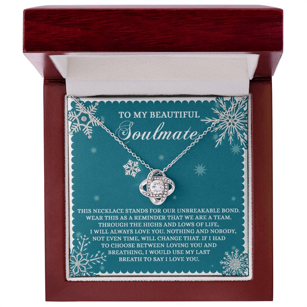 The Soulmate-A Team - Love Knot Necklace comes beautifully packaged in a box, featuring a heartfelt message addressed to "Soulmate" and adorned with Cubic Zirconia Crystals, celebrating love and togetherness.