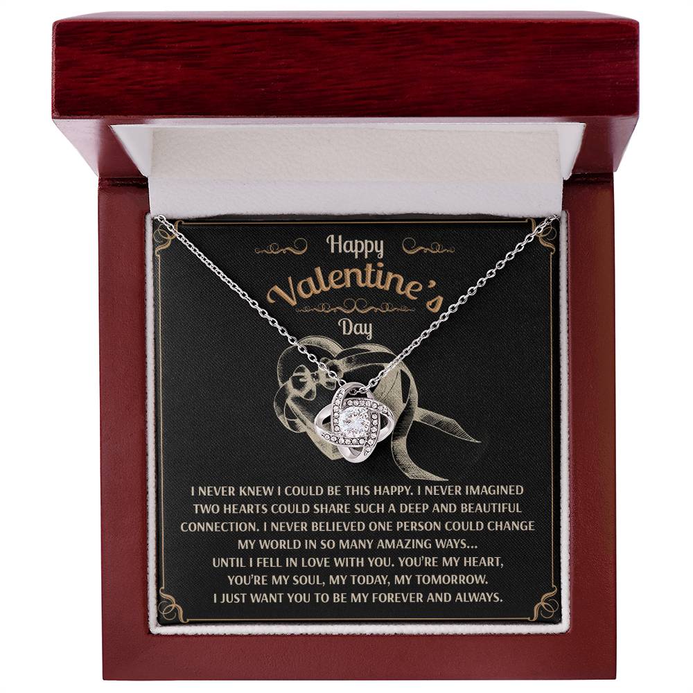 Open jewelry box to reveal the Soulmate-Amazing Ways Love Knot Necklace, showcasing a stunning cubic zirconia pendant and an engraved message conveying profound affection and a longing for eternal love.