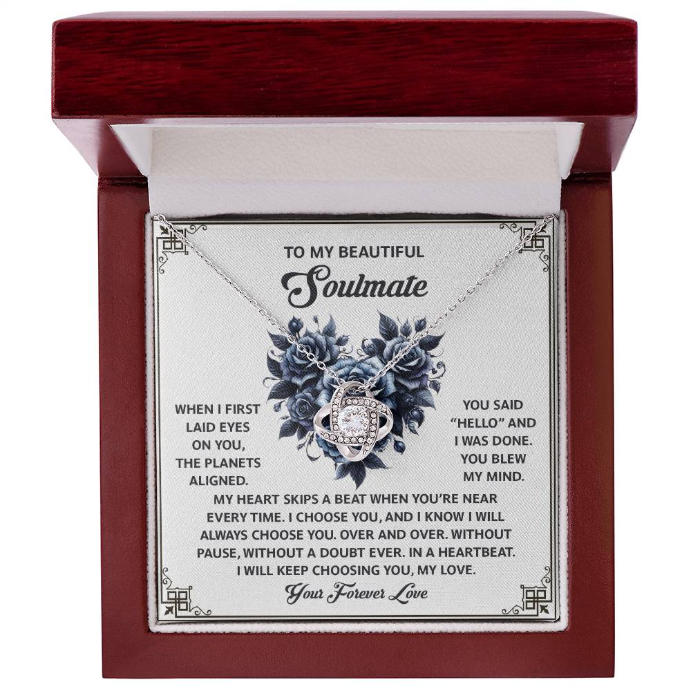 The Soulmate-Skips A Beat Love Knot Necklace, adorned with cubic zirconia crystals, arrives in an elegant box with a romantic message card celebrating love and soulmates—perfect for expressing timeless affection.