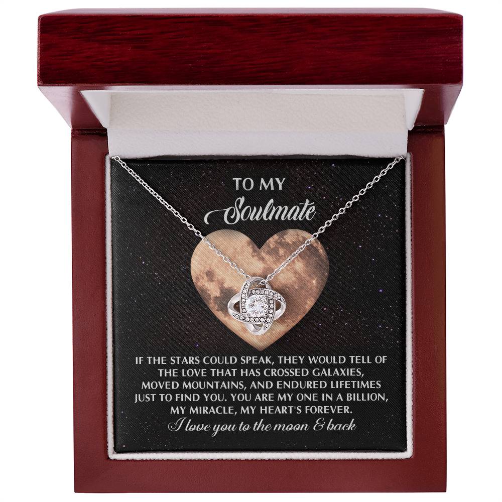 The Soulmate-Crossed Galaxies - Love Knot Necklace, embellished with cubic zirconia crystals, rests gracefully inside a red box. Paired with a heartfelt card for a soulmate, this personalized gift perfectly captures the essence of deep connection and enduring love.