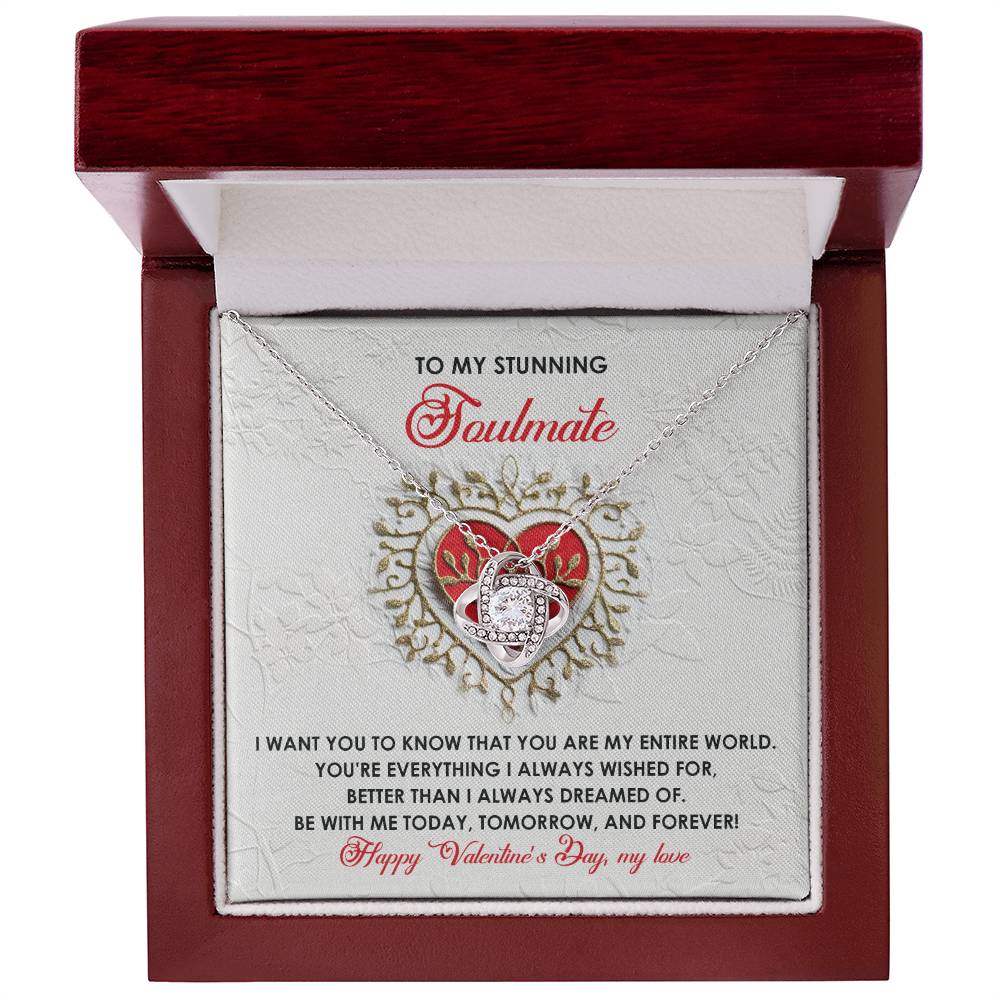 The "Soulmate-Be With Me - Love Knot Necklace" shines with its gold finish and cubic zirconia crystals, featuring a heart-shaped pendant in a gift box with a Valentine's Day message for your "soulmate.