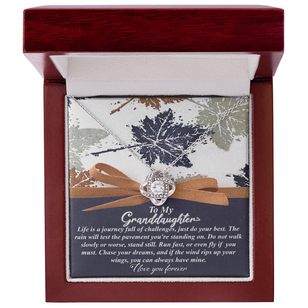 A Love Knot Necklace presented in a decorative box, featuring a motivational message to a granddaughter.