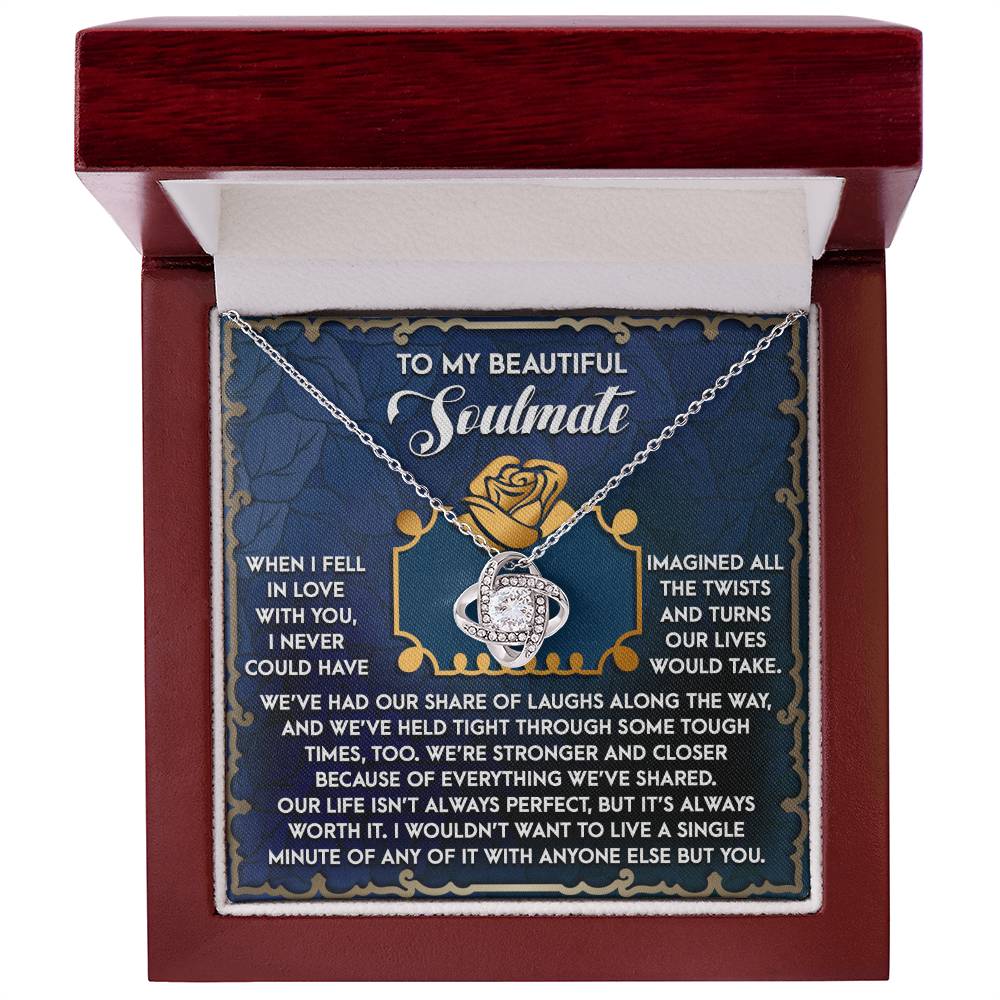 The Soulmate-The Way - Love Knot Necklace showcases intertwined rings with sparkling cubic zirconia crystals, elegantly boxed. Inside, an engraved card reads "To my beautiful soulmate," with a heartfelt message, making it the ideal personalized gift.