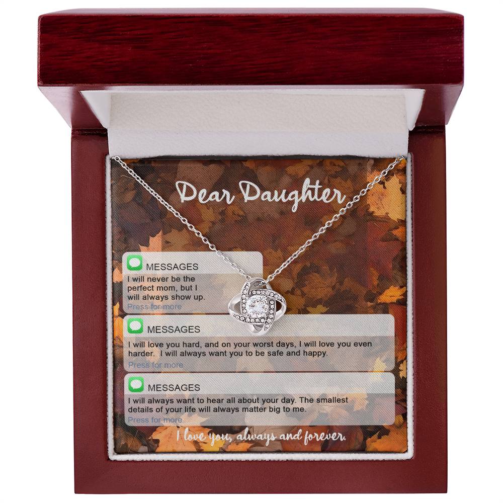 The Daughter-Perfect Mom - Love Knot Necklace is showcased in a red box with the inscription "Dear Daughter." Below are three message icons with heartfelt text, and an inscription at the bottom reads, "I love you, always and forever." The necklace features a stunning cubic zirconia centerpiece and a gold finish for added elegance.