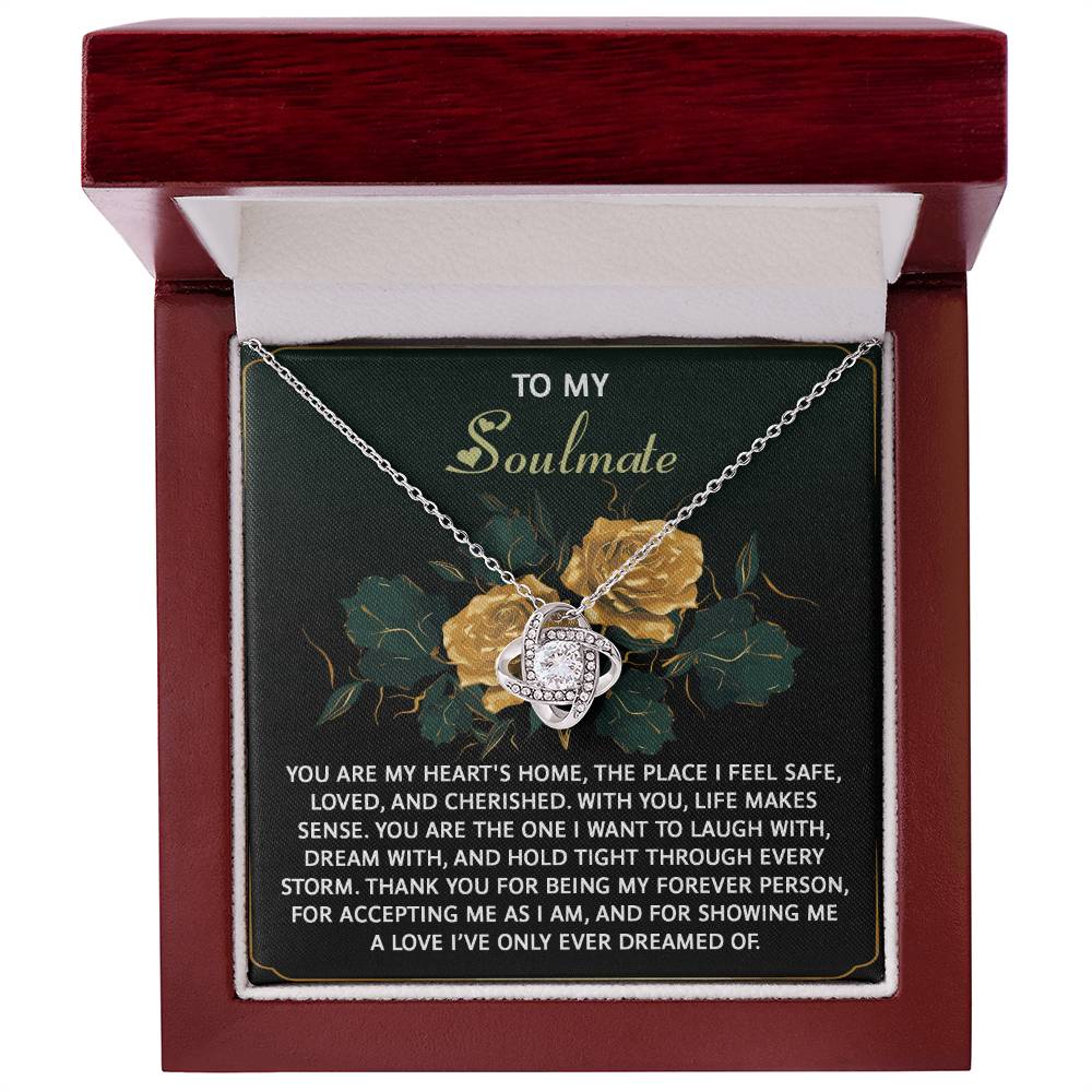 The Soulmate-Forever Person Love Knot Necklace features interlocking hearts with cubic zirconia, presented in a wooden box. The lid reads "To My Soulmate" and has a romantic message on a floral background, all crafted from luxurious 14k white gold.
