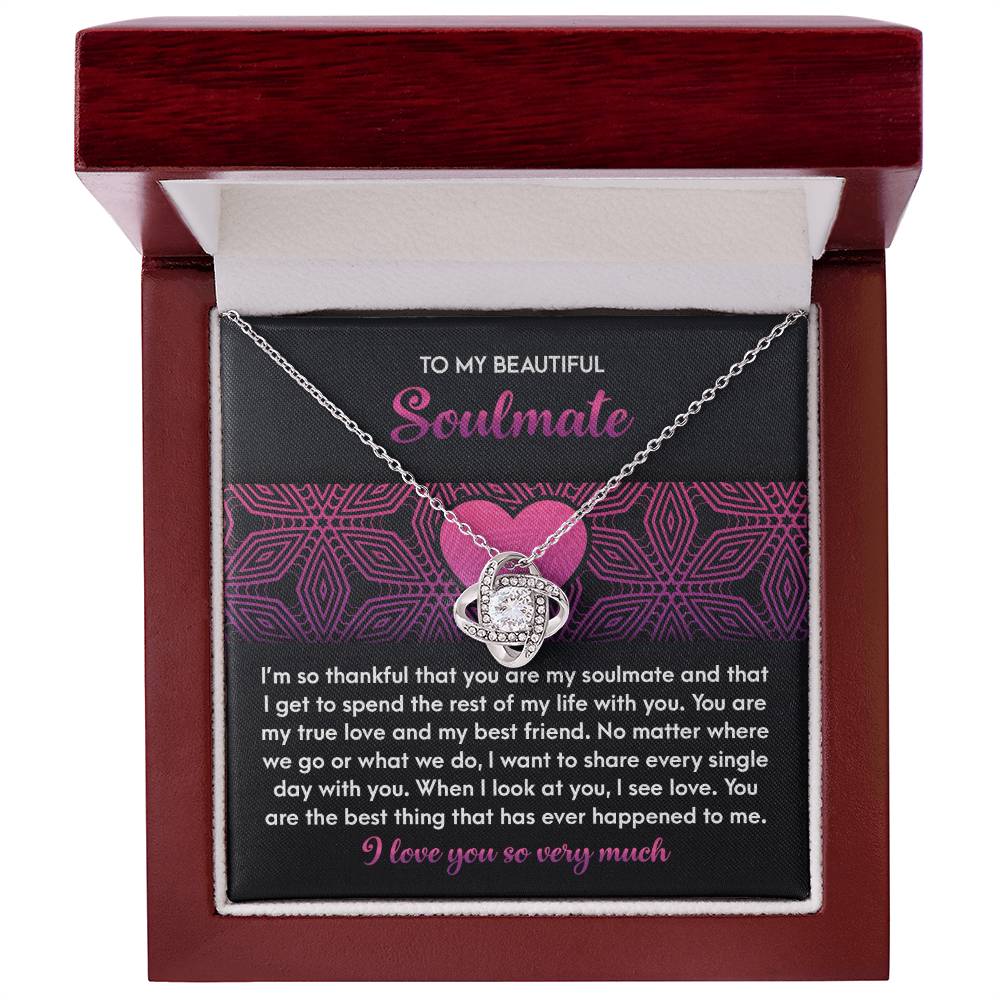 Presented in a wooden box, the Soulmate-I See Love - Love Knot Necklace showcases sparkling cubic zirconia crystals, with a touching message of gratitude and love to a soulmate, celebrating an unbreakable bond.