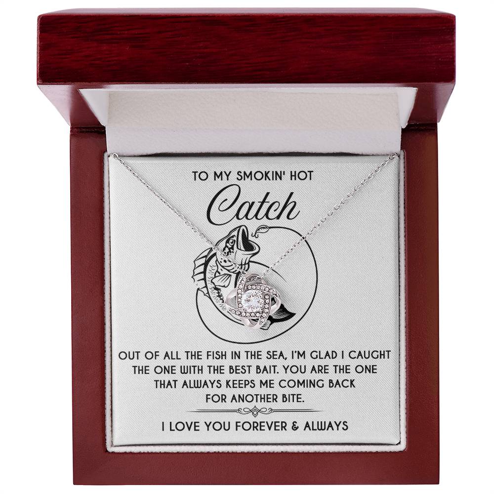 The "Soulmate-Another Bite" Love Knot Necklace comes in a box with fish and heart illustrations, featuring the message: "To my smokin' hot catch," followed by a romantic message of love, ending with "I love you forever & always.