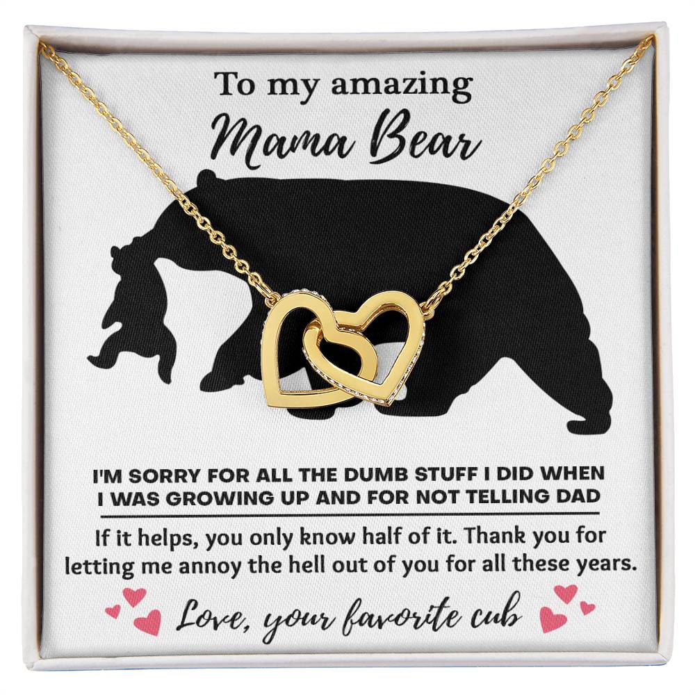 The "To Mom, Not Telling Dad - Interlocking Hearts Necklace" is elegantly adorned with cubic zirconia crystals on a bear-themed card, expressing a child's apology and gratitude to their "Mama Bear" for past behavior.