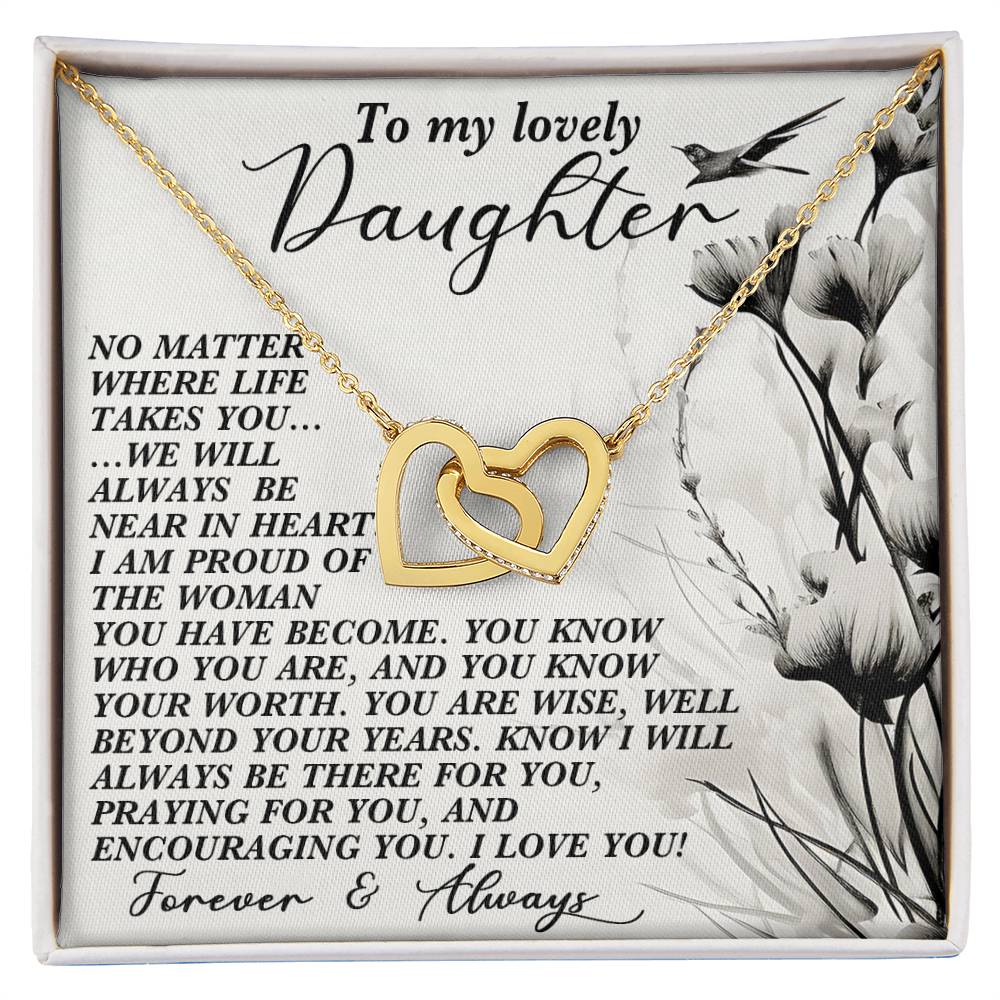 The Daughter-Heart Near Interlocking Hearts Necklace, crafted in gold and adorned with cubic zirconia crystals, comes on a heartfelt card conveying love, encouragement, and support to a daughter. The card's floral and bird motifs make it an ideal gift choice.