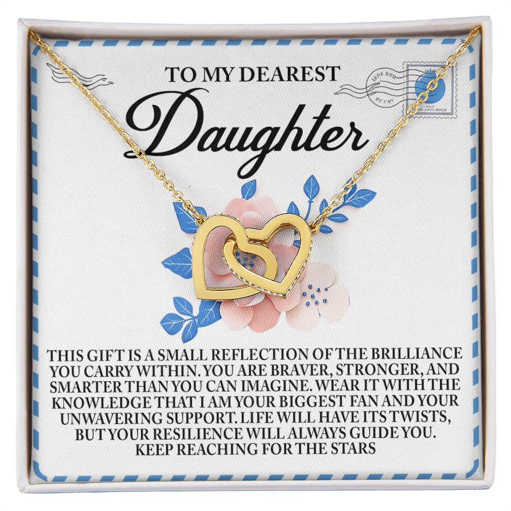 The Daughter-Brilliance Within Interlocking Hearts Necklace features a rose gold finish and cubic zirconia crystals, presented on a card with blue leaves and a loving message about love and support, making it an ideal gift for a cherished daughter.