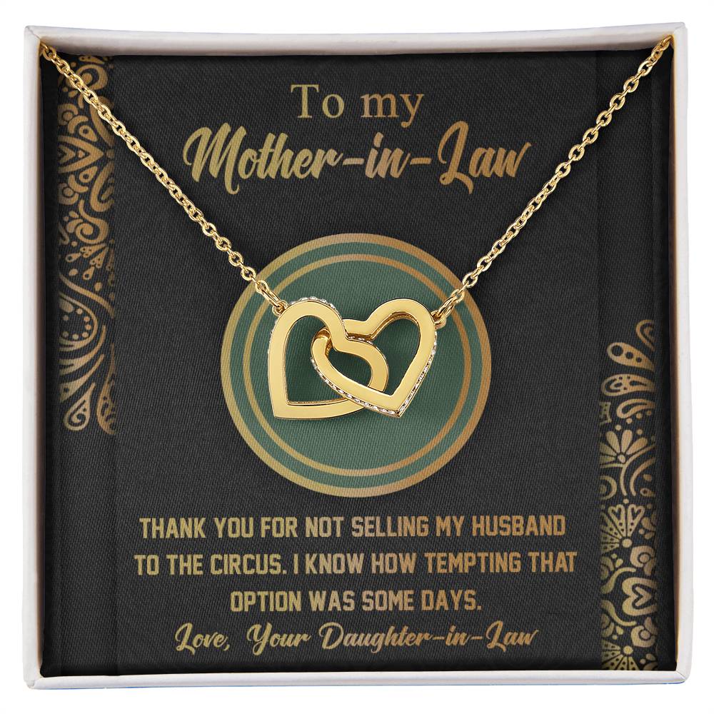 The "To Mother-In-Law, Thank You - Interlocking Hearts Necklace" features gold interlocking hearts with sparkling cubic zirconia on a card that says, "To my Mother-in-Law...Thank you for not selling my husband to the circus...Love, Your Daughter-in-Law." A unique gift sure to bring a smile.