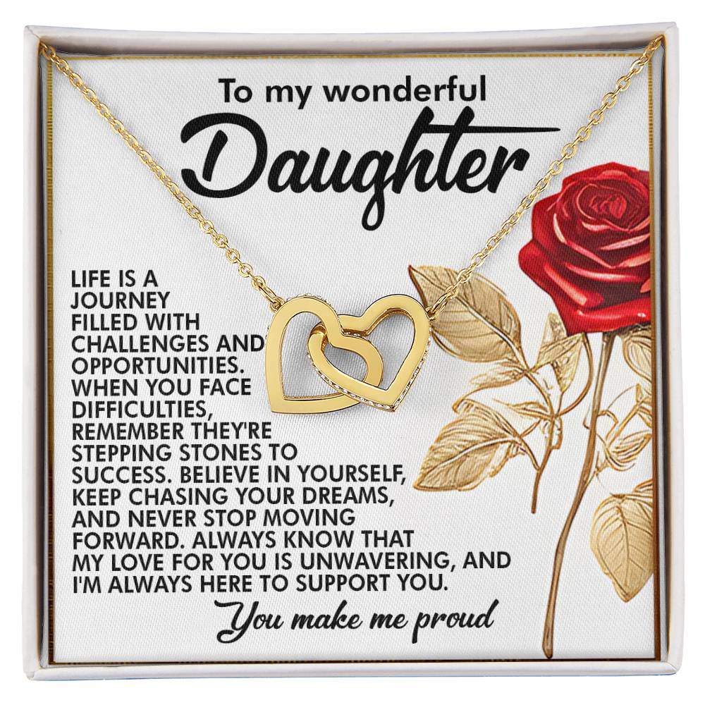 A box with the Daughter-Journey Challenges - Interlocking Hearts Necklace in a stunning rose gold finish. Set against a background that features an inspiring message for a daughter, it includes a red rose illustration and sparkling cubic zirconia.