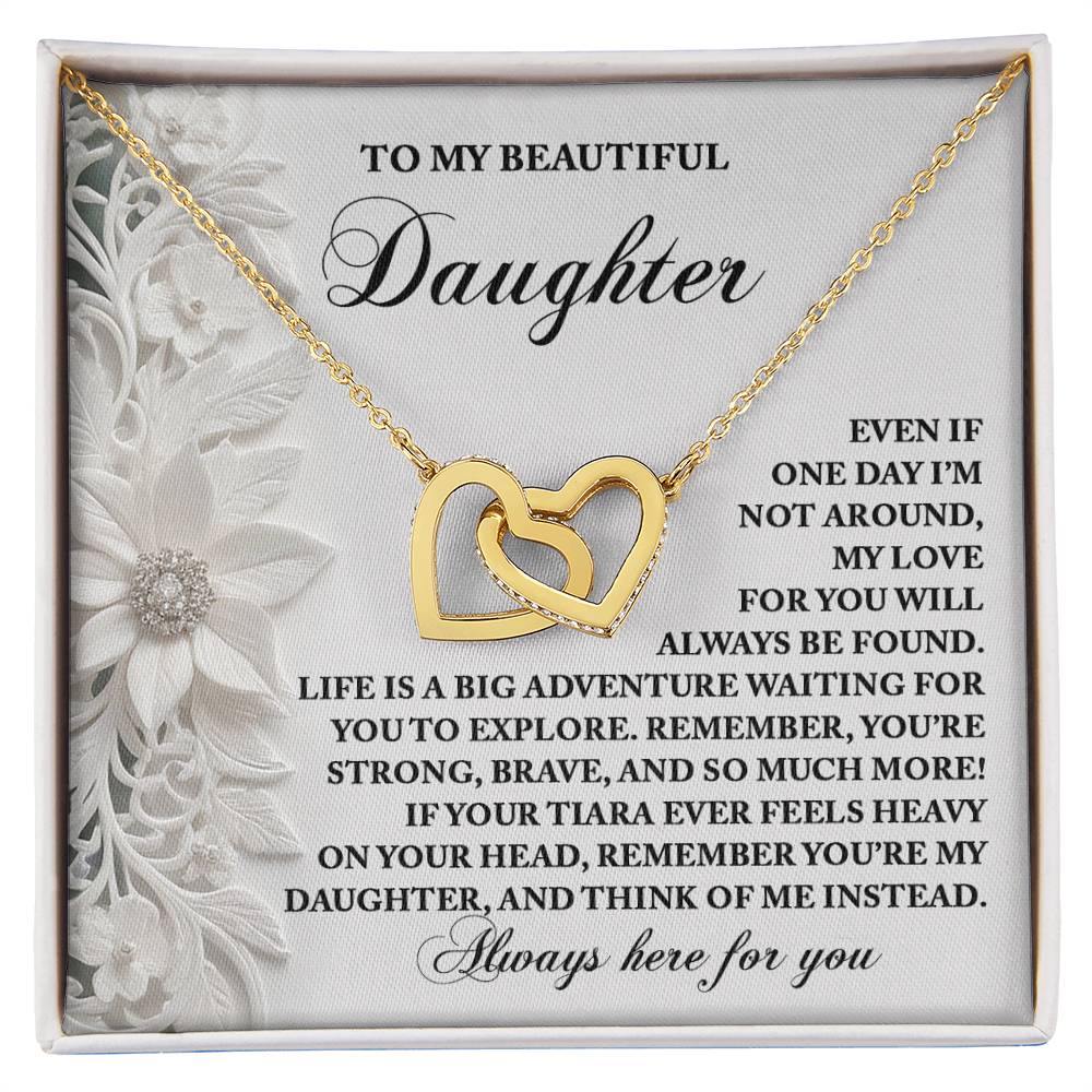 The Daughter-Think Of Me - Interlocking Hearts Necklace, embellished with cubic zirconia crystals on a floral backdrop, radiates love and encouragement for a daughter.
