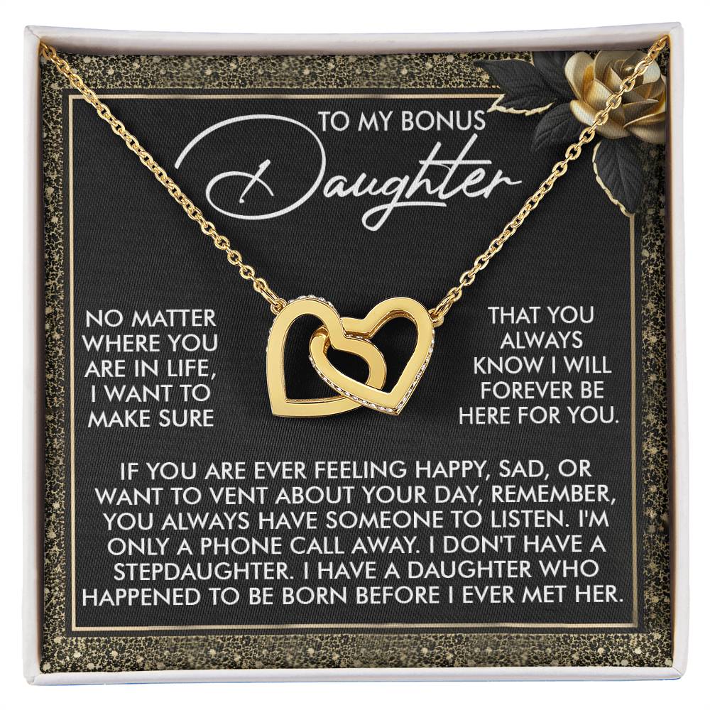 The Daughter-Phone Call Interlocking Hearts Necklace, crafted from surgical steel with a rose gold finish, is presented in a box featuring a heartfelt message for a bonus daughter. Enhanced with cubic zirconia crystals, this piece symbolizes care and support.
