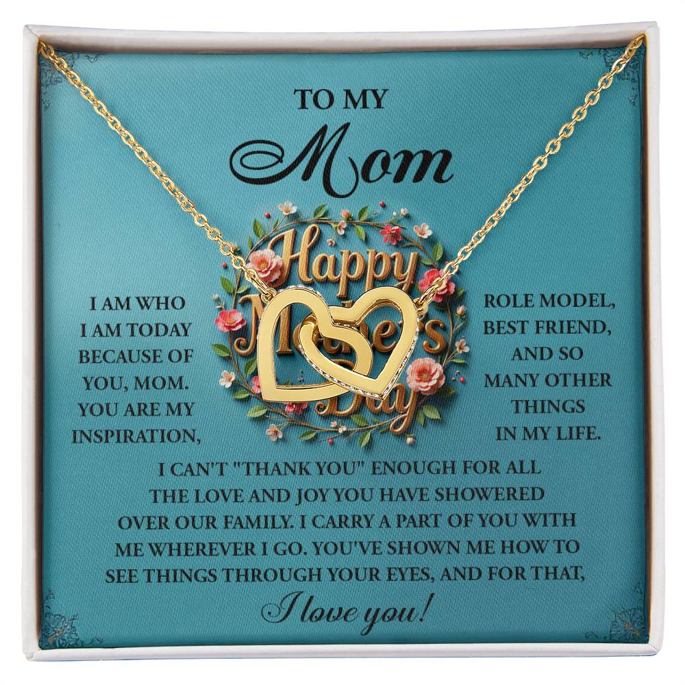 The Mom-Our Family Interlocking Hearts Necklace features cubic zirconia crystals, elegantly boxed with a heartfelt message of gratitude and love, celebrating mom as an inspiration, role model, and best friend.