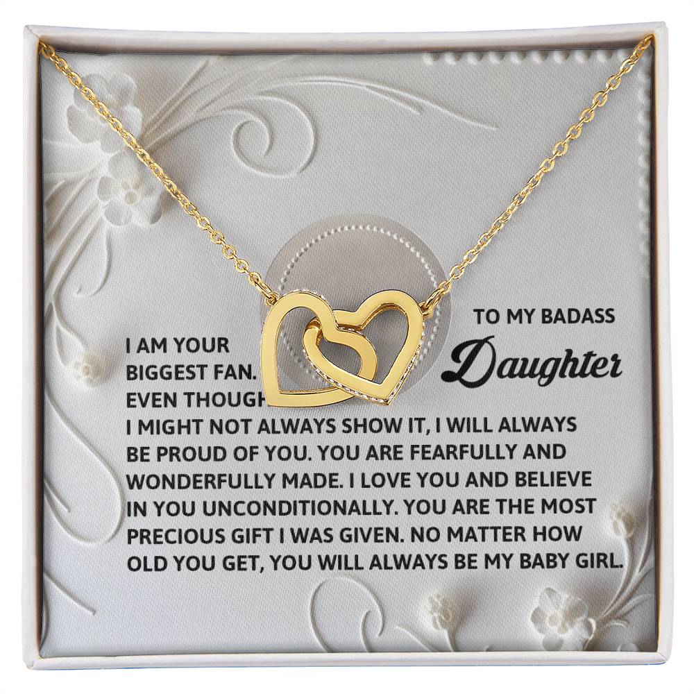 The Daughter-My Baby Girl Interlocking Hearts Necklace, adorned with cubic zirconia crystals, features a heartfelt message to a daughter. Its rose gold finish and floral embossing add an exquisite touch to this cherished gift.