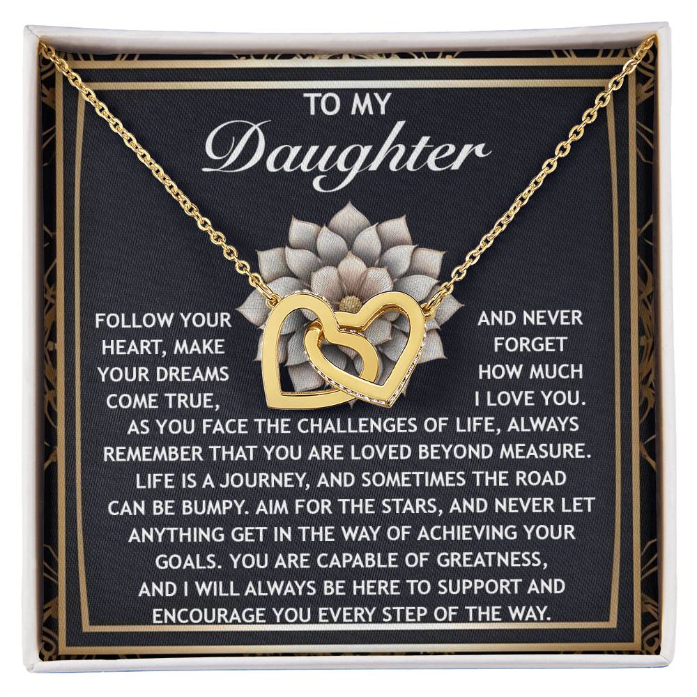 The Daughter-In The Way - Interlocking Hearts Necklace features an elegant rose gold finish with sparkling cubic zirconia crystals. It presents beautifully, complete with an inspirational message, making it the ideal gift for a cherished daughter.