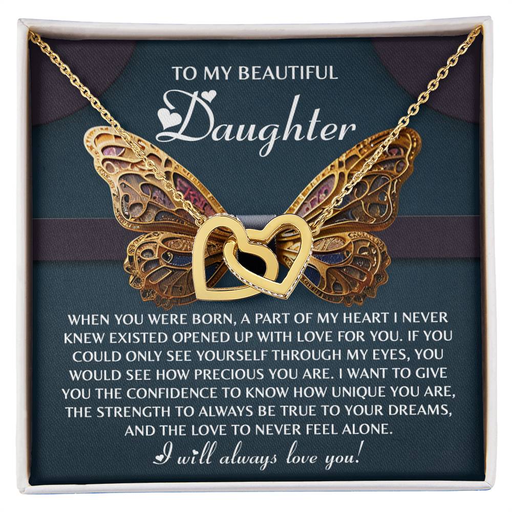 The Daughter-Never Feel Alone Interlocking Hearts Necklace features a gold butterfly-shaped design with cubic zirconia crystals. It's set in a gift box with an emotional message to a daughter celebrating her uniqueness and the giver's love.