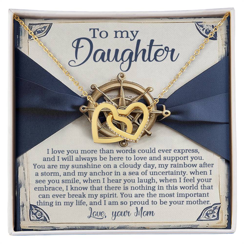 The Daughter-Sunshine Anchor necklace features interlocking hearts in surgical steel and rose gold finish, presented in a gift box with cubic zirconia crystals. It includes a heartfelt message from mom to daughter, set against a blue ribbon background with love and support symbols.