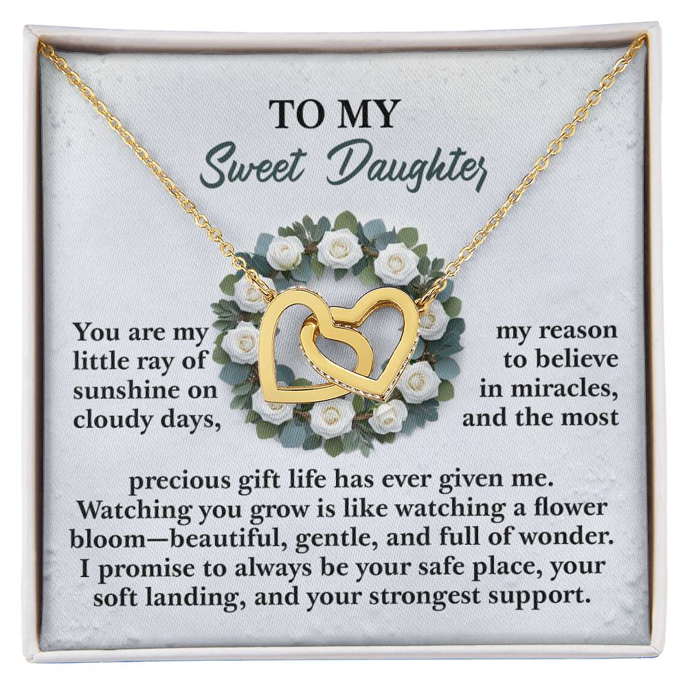 The "Daughter-Strongest Support" gift box includes an Interlocking Hearts rose gold necklace adorned with cubic zirconia crystals and white roses. The box lid features a touching message for a daughter.