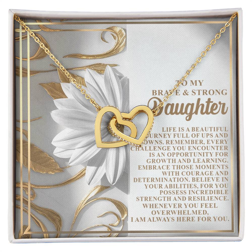 Discover the Daughter-Here For You Interlocking Hearts Necklace, featuring cubic zirconia crystals on a decorative card with floral designs and a heartfelt message of love and encouragement to a daughter.