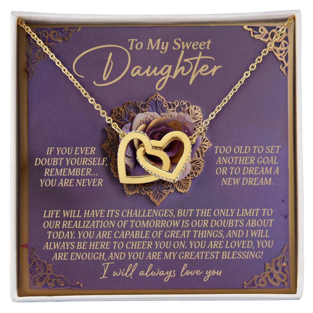 The Daughter-Greatest Blessing Interlocking Hearts Necklace, with a rose gold finish, is presented on a purple card adorned with roses and featuring heartfelt messages of love, support, and encouragement for a daughter.