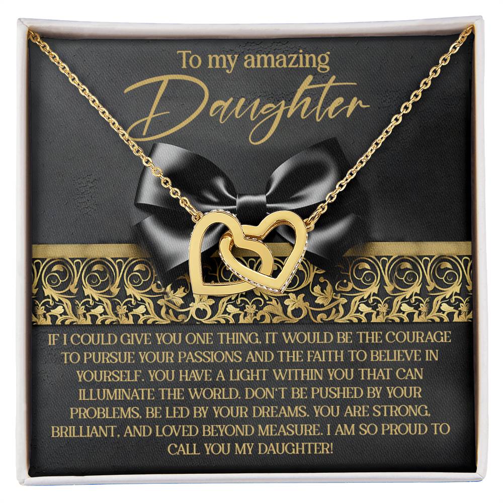 The Daughter-Pursue Passions Interlocking Hearts Necklace in rose gold is beautifully presented on a black and gold card. With the heartfelt message, "To my amazing daughter," it perfectly captures pride, love, and encouragement.